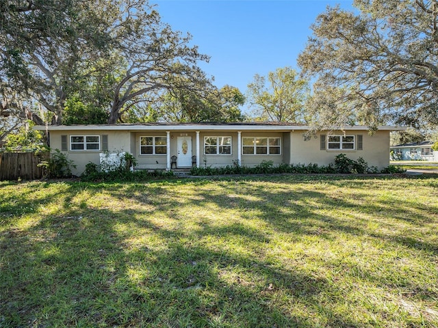 ranch-style house featuring a front lawn