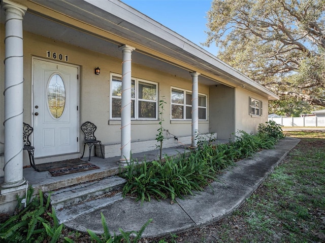 entrance to property with a porch