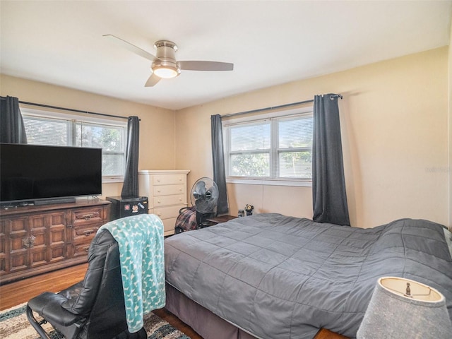 bedroom featuring hardwood / wood-style floors and ceiling fan