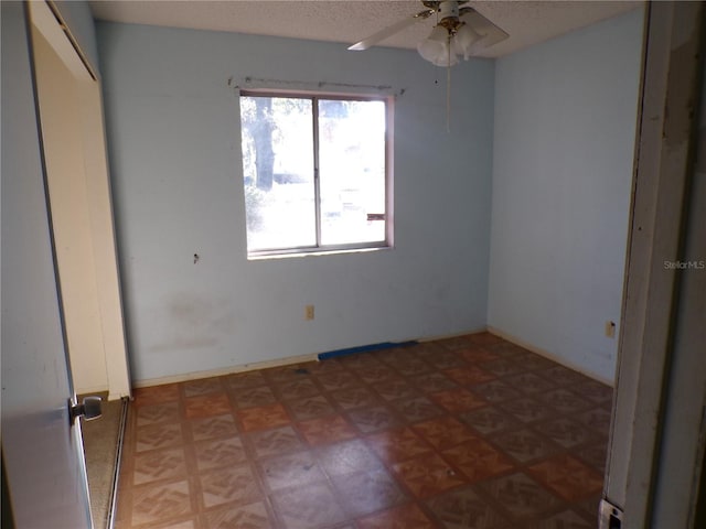 unfurnished bedroom featuring ceiling fan and parquet flooring