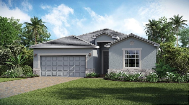 view of front of property featuring a garage and a front lawn