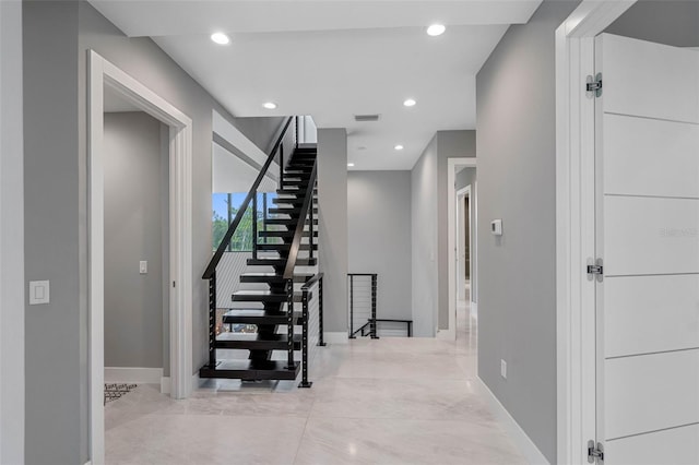 interior space with recessed lighting, visible vents, and baseboards