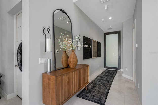 corridor featuring recessed lighting, baseboards, and visible vents