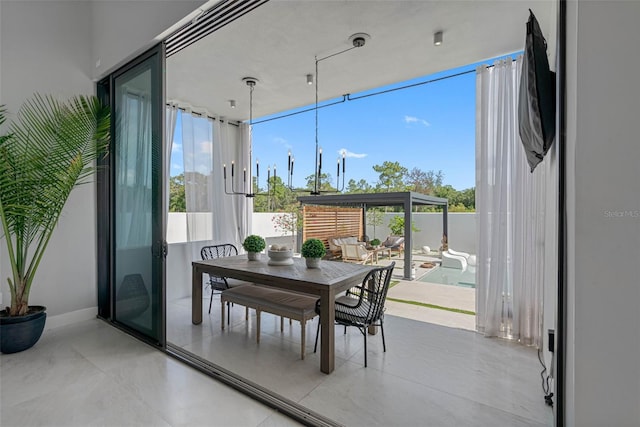 interior space with expansive windows and baseboards