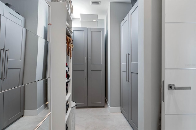 bathroom featuring a closet and visible vents