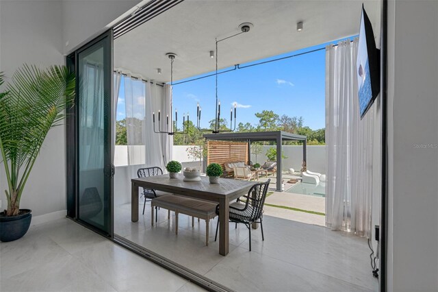 interior space featuring expansive windows and baseboards