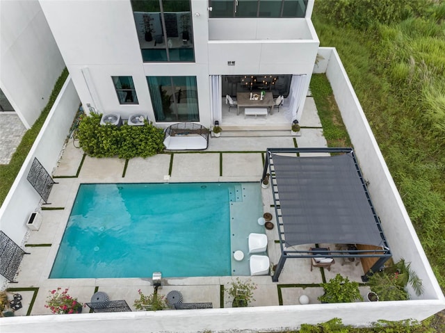 view of pool featuring a patio and a fenced backyard