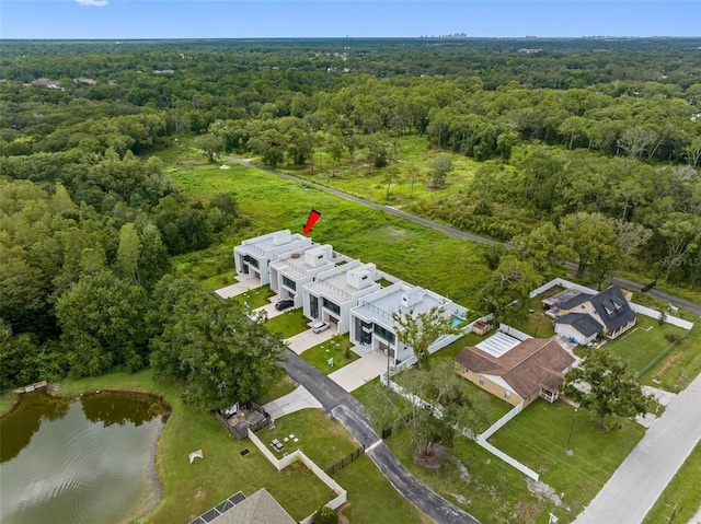 aerial view featuring a wooded view