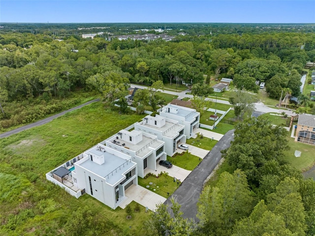 drone / aerial view featuring a view of trees