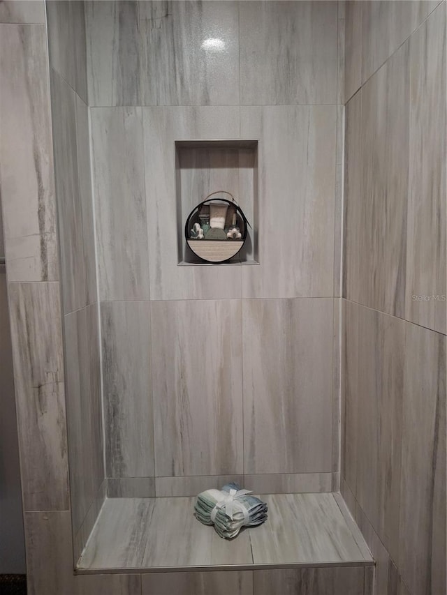 bathroom with a tile shower