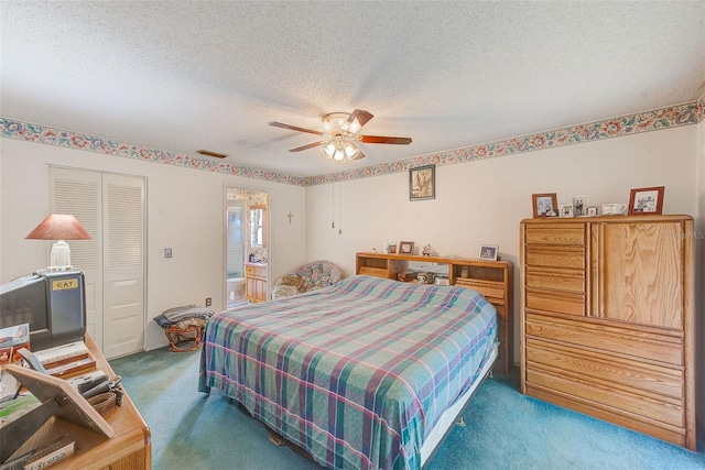 carpeted bedroom featuring ceiling fan, a textured ceiling, connected bathroom, and a closet