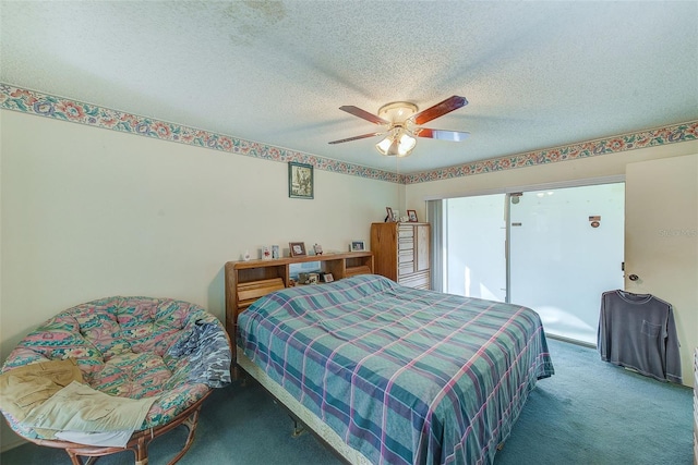 bedroom featuring ceiling fan, carpet floors, and a textured ceiling