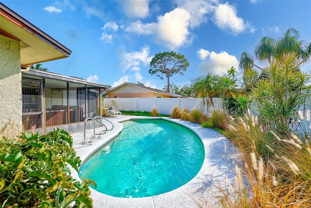 view of swimming pool with a sunroom