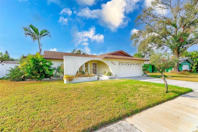 ranch-style home with a front yard and a garage