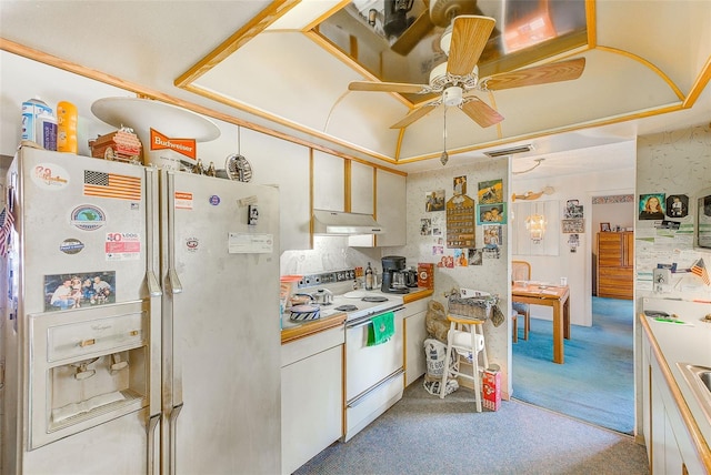 kitchen featuring white cabinets, light carpet, ceiling fan, and white appliances