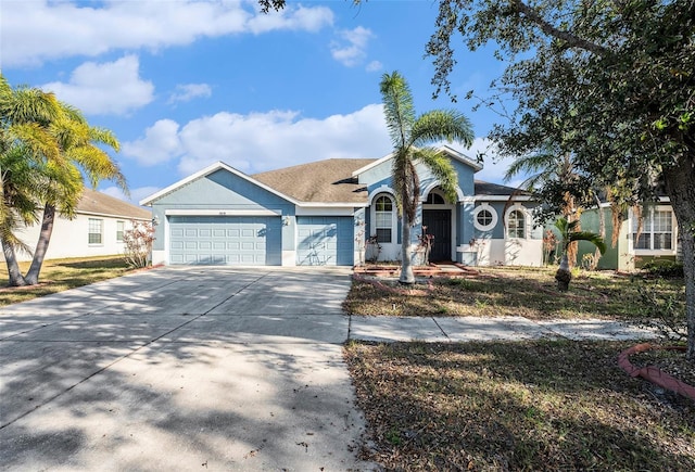 single story home featuring a garage