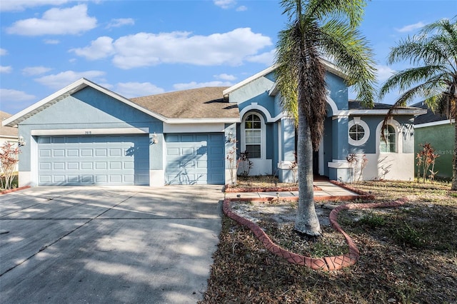 single story home featuring a garage