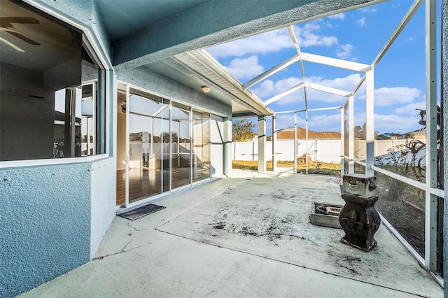 view of patio / terrace featuring glass enclosure