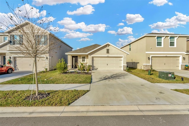 front of property with a garage and a front lawn