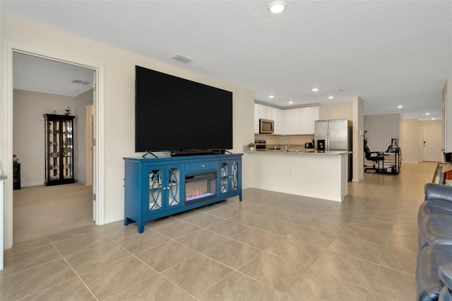 living room featuring light tile patterned floors