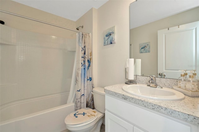 full bathroom featuring shower / tub combo, vanity, and toilet