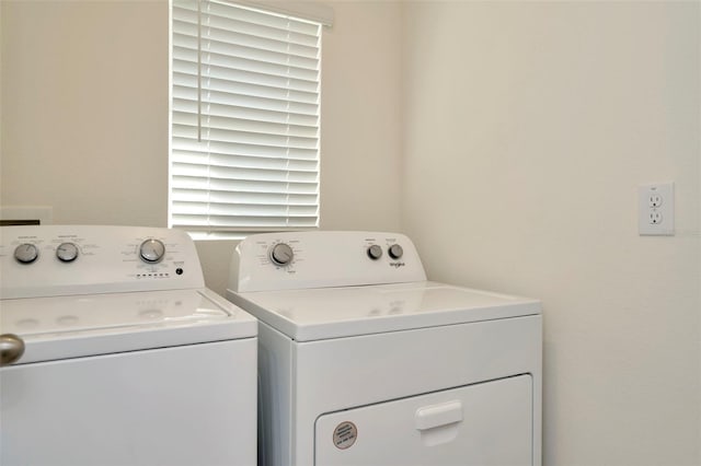 laundry room featuring washer and clothes dryer