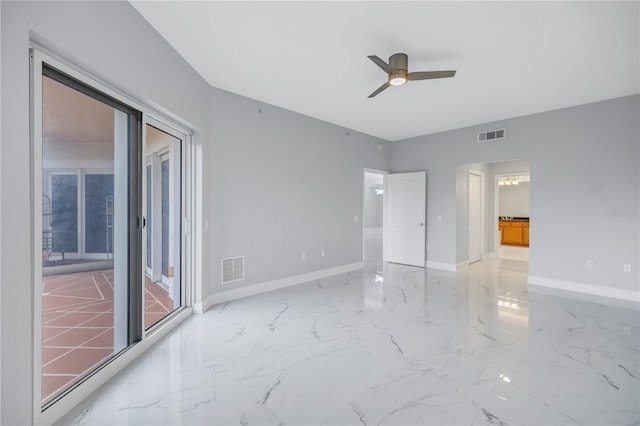 spare room with ceiling fan