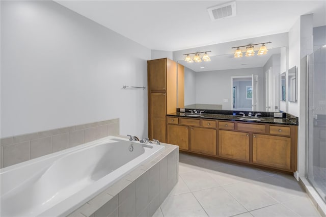 bathroom with tile patterned floors, plus walk in shower, and vanity