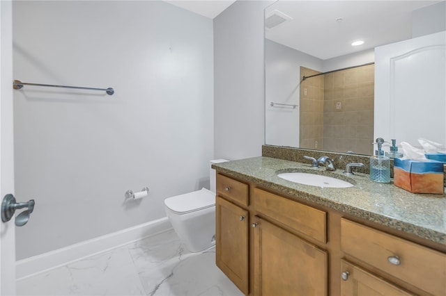 bathroom featuring vanity and toilet