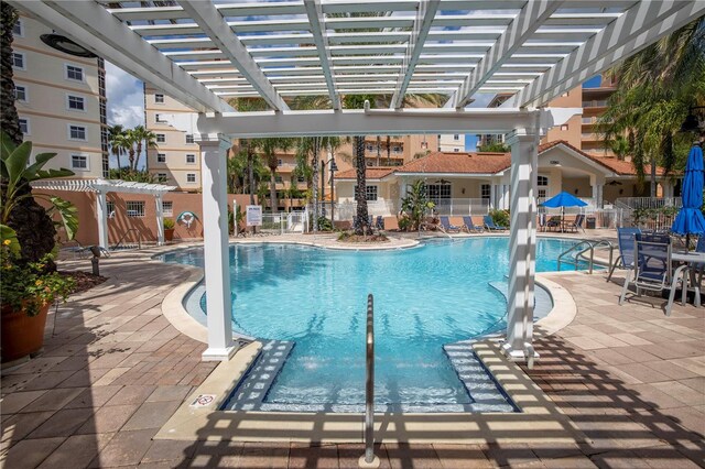 view of pool featuring a pergola and a patio