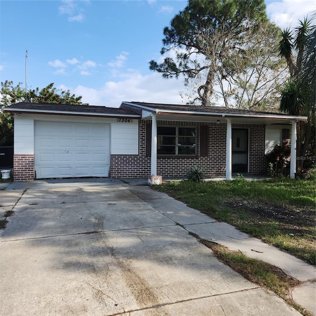 ranch-style house with covered porch and a garage