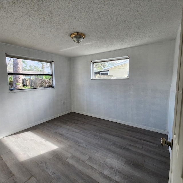 empty room featuring dark wood-type flooring