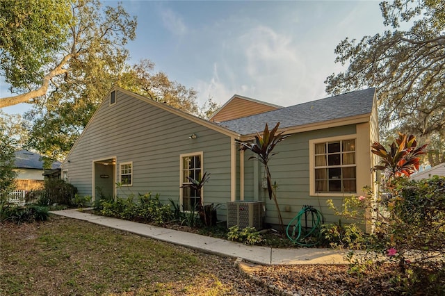 back of house featuring cooling unit