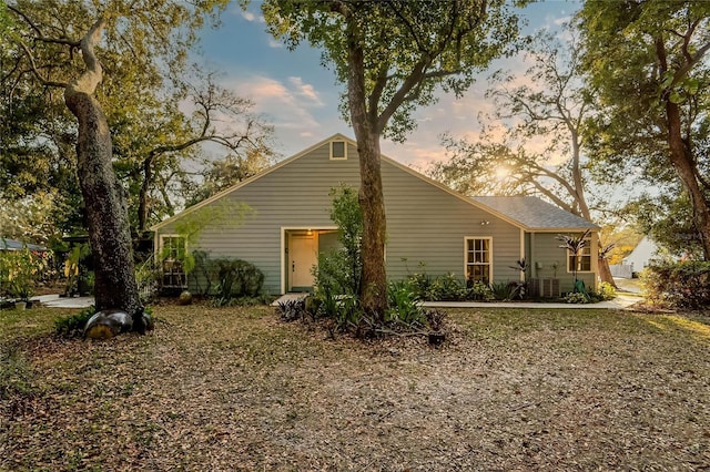 view of back house at dusk