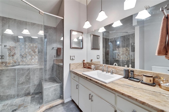 bathroom with vanity, tile patterned flooring, a shower with shower door, and toilet