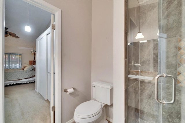 bathroom featuring walk in shower, ceiling fan, and toilet