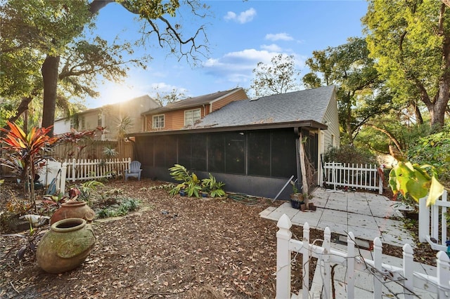 view of property exterior featuring a sunroom