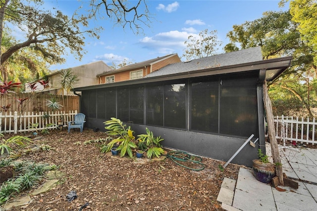 view of home's exterior featuring a sunroom