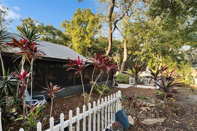 view of yard featuring a sunroom