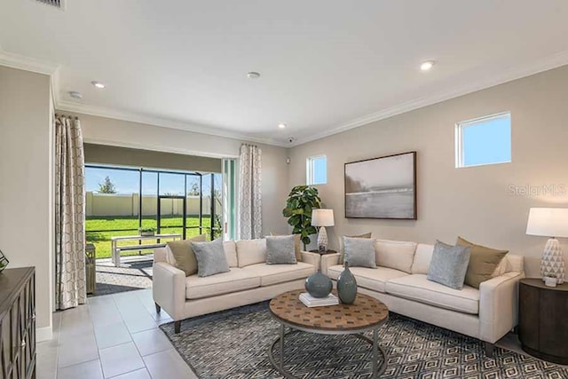 tiled living room featuring a healthy amount of sunlight and ornamental molding