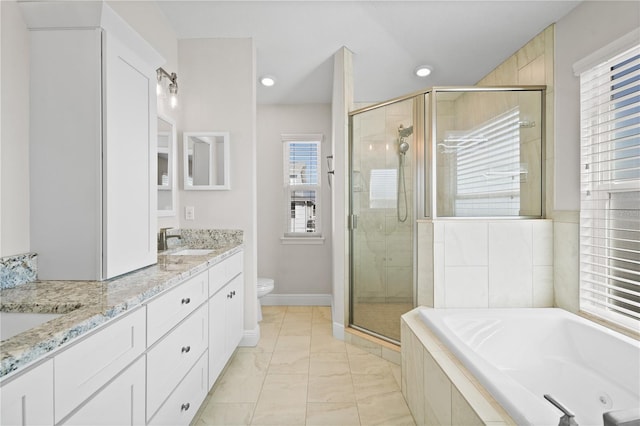 full bathroom featuring plus walk in shower, vanity, and toilet