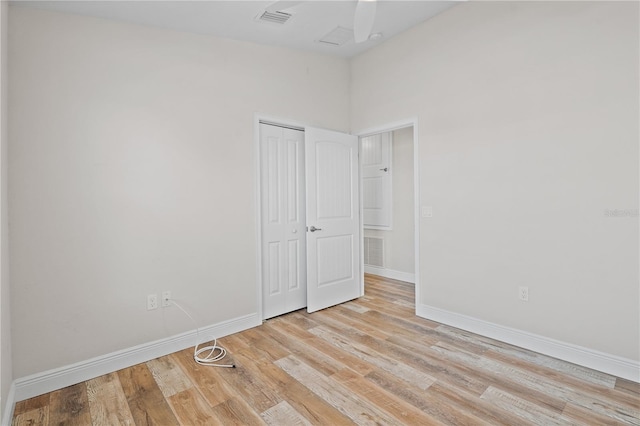 unfurnished room with light wood-type flooring