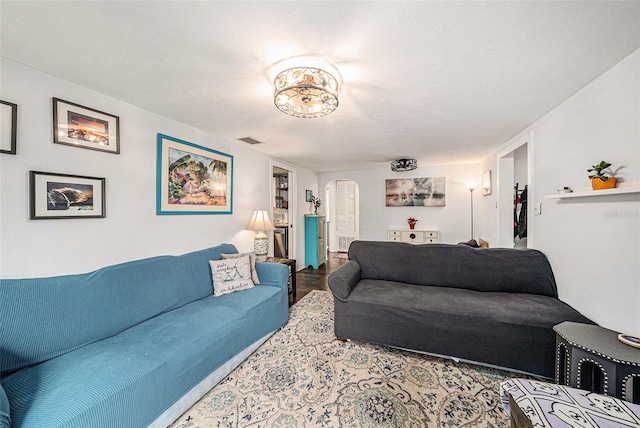 living room with a textured ceiling