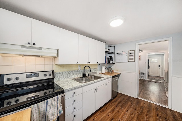 kitchen featuring stainless steel appliances, sink, white cabinets, and dark hardwood / wood-style floors