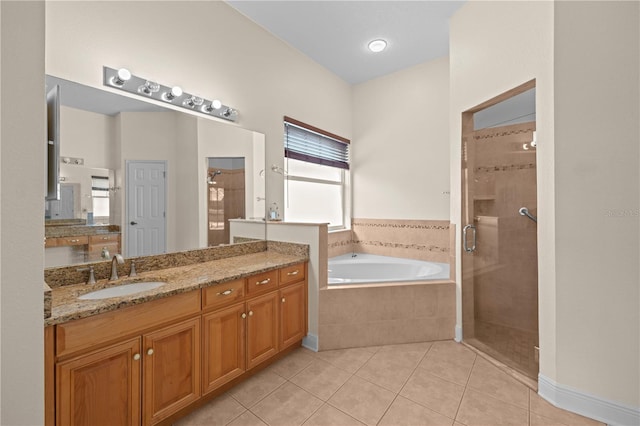 full bath with tile patterned flooring, a shower stall, vanity, and a garden tub