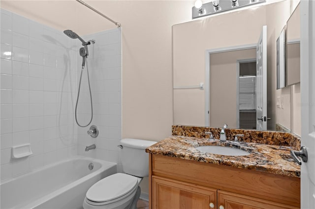 bathroom with vanity,  shower combination, and toilet