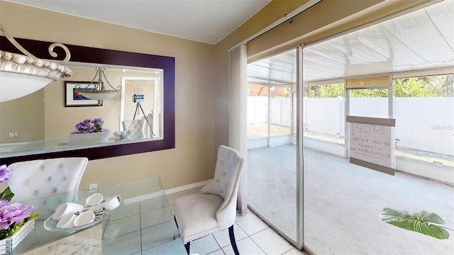 tiled dining area featuring a healthy amount of sunlight