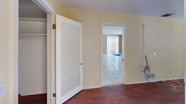 corridor featuring dark hardwood / wood-style floors