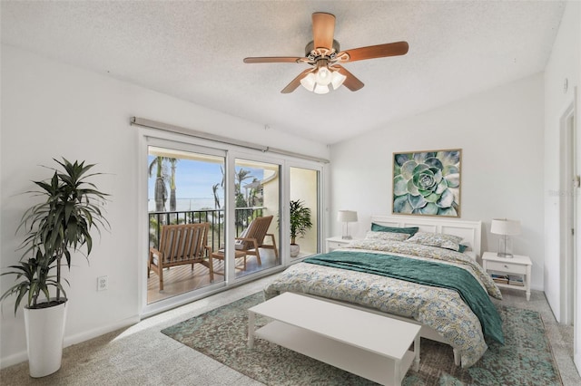 bedroom featuring vaulted ceiling, a textured ceiling, carpet flooring, ceiling fan, and access to exterior