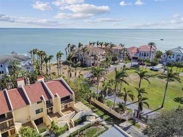 drone / aerial view with a water view and a residential view